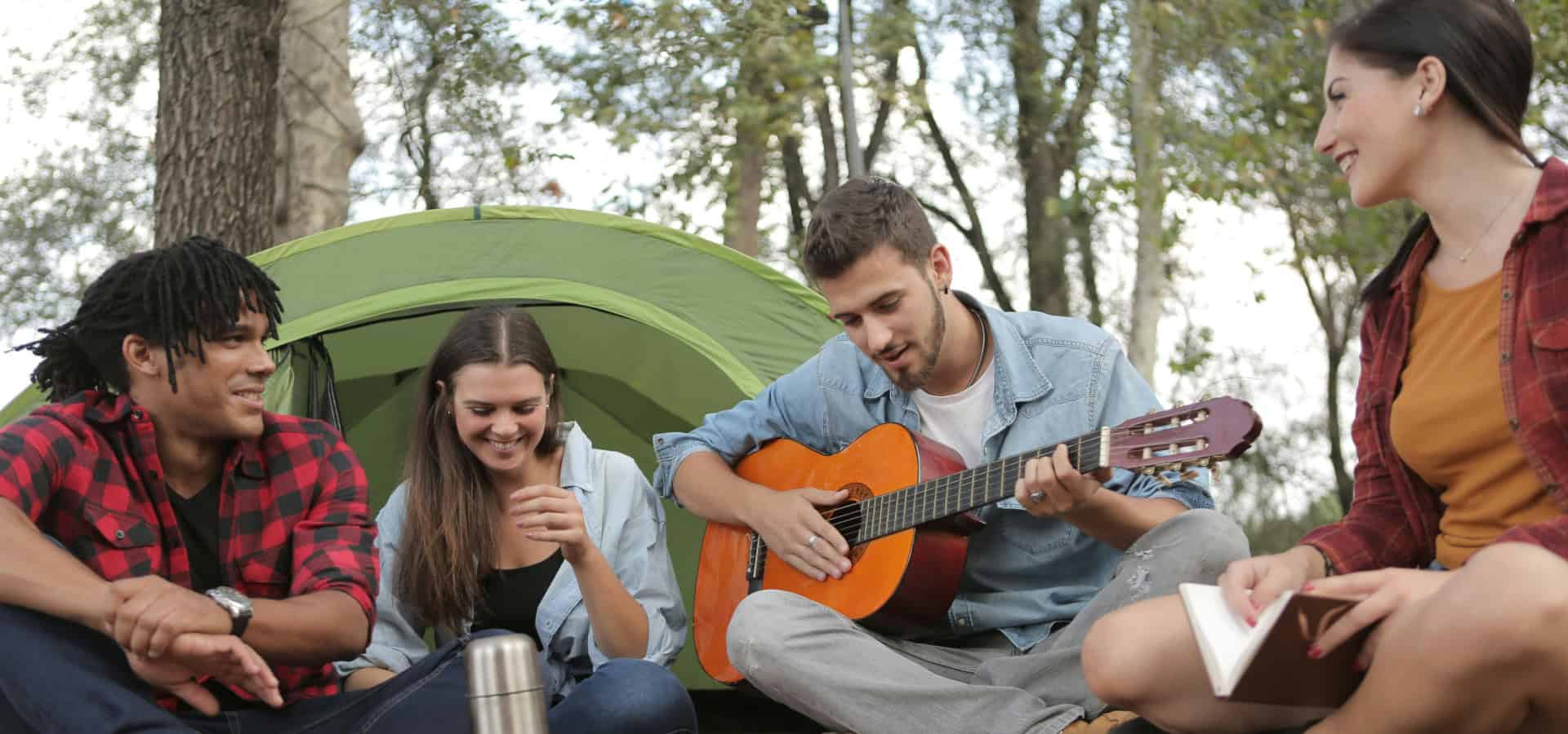 People camping and singing